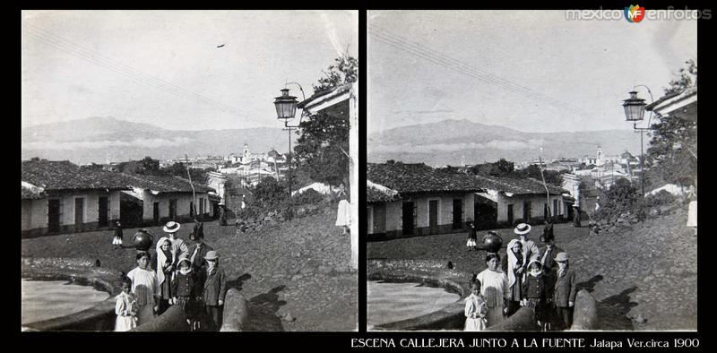 ESCENA CALLEJERA JUNTO A LA FUENTE