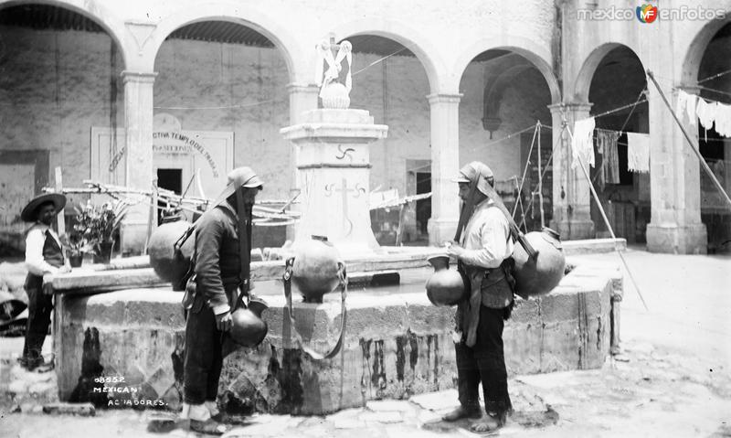 Aguadores en una fuente (por William Henry Jackson, c. 1888)