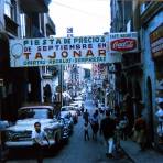 Escena callejera Tienda Tajonar y Cafe Negrito posiblemente en Cuernavaca Morelos en 1963
